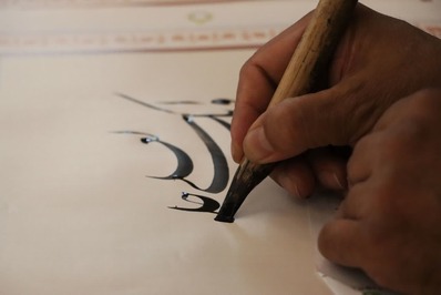 کتابت آیاتی از کلام وحی در محکومیت هتک حرمت قرآن در رشت انجام شد