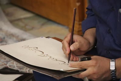 کتابت آیاتی از کلام وحی در محکومیت هتک حرمت قرآن در رشت انجام شد